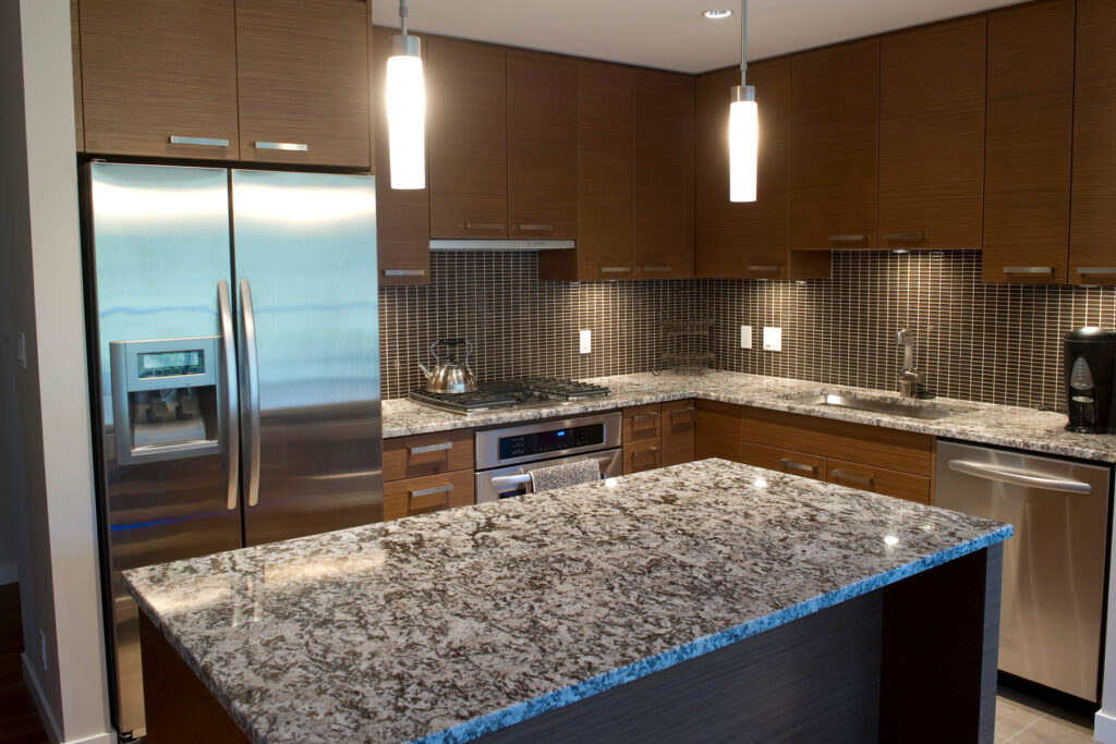 Kitchen Remodel with dark wood and granite countertops