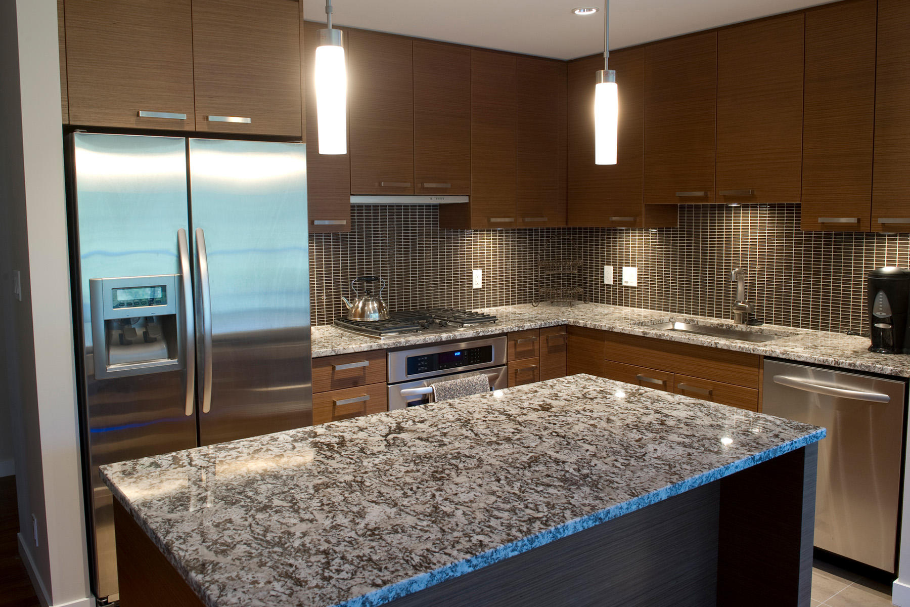 Kitchen Remodel with dark wood and granite countertops