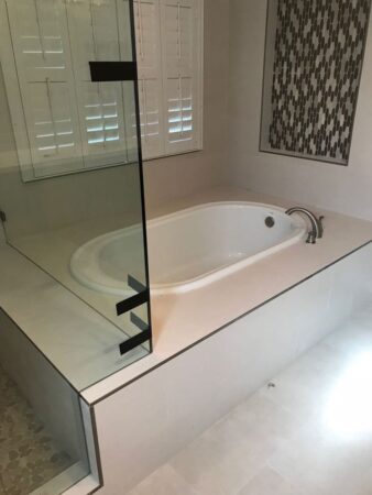 New tub installation, next to shower renovation, fancy deep step down pedestal tub