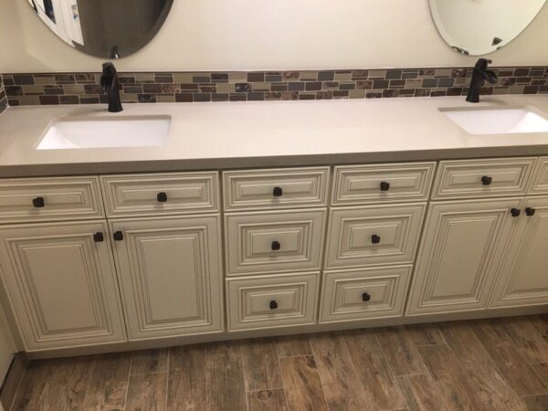 New cabinets, bathroom vanities, countertops, and backsplash