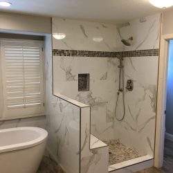 New shower enclosure, stylish wood laminate flooring, freestanding tub